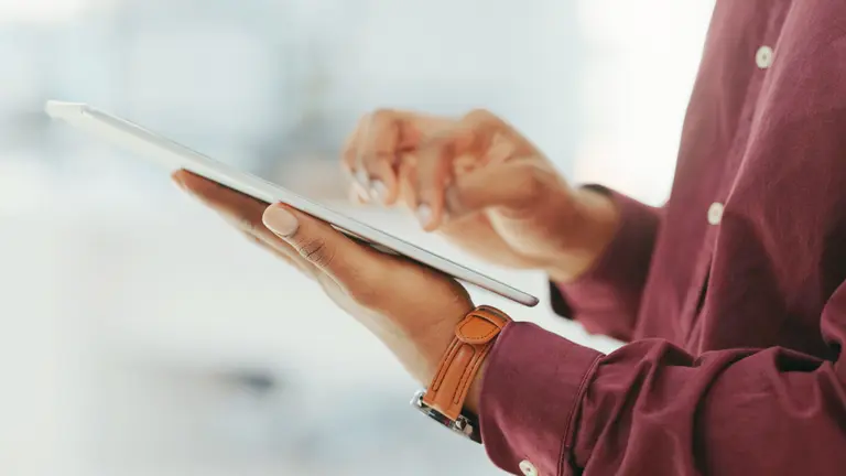 man holding an ipad